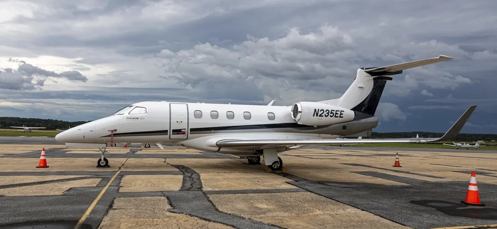Embraer Phenom 300 light jet on airport ramp